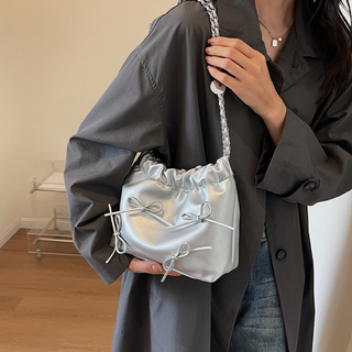 Sleek Silver Bow Clutch